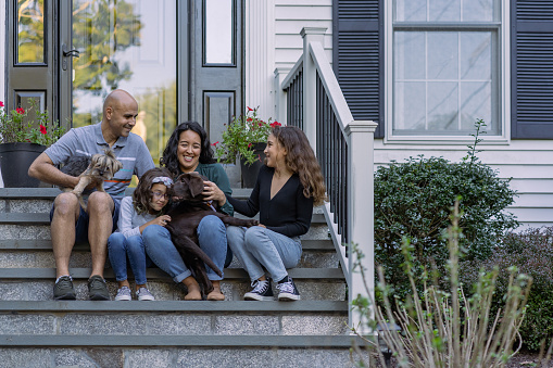 Family in front of their house