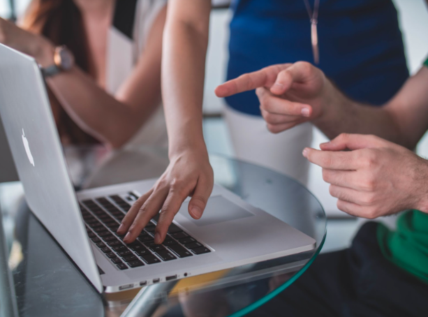 man pointing at computer to Conduct An Experience Modification Audit